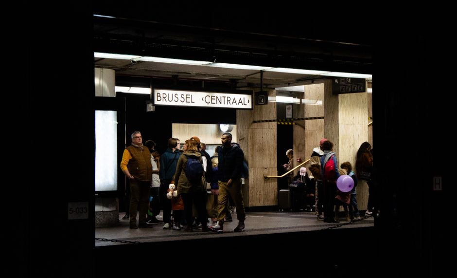 crowded metro station passengers festival wristbands night